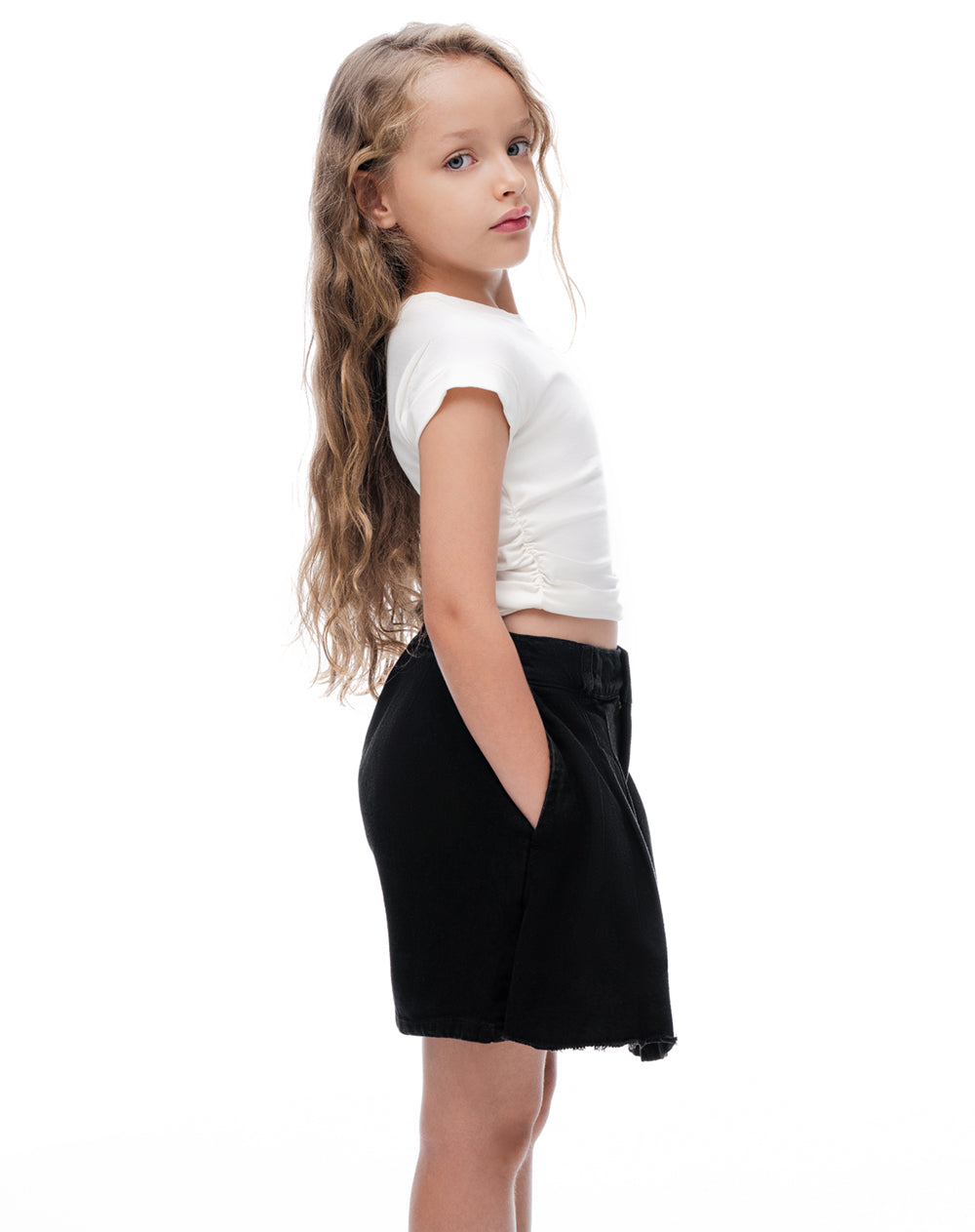 Falda corto tiro medio denim negro niña
