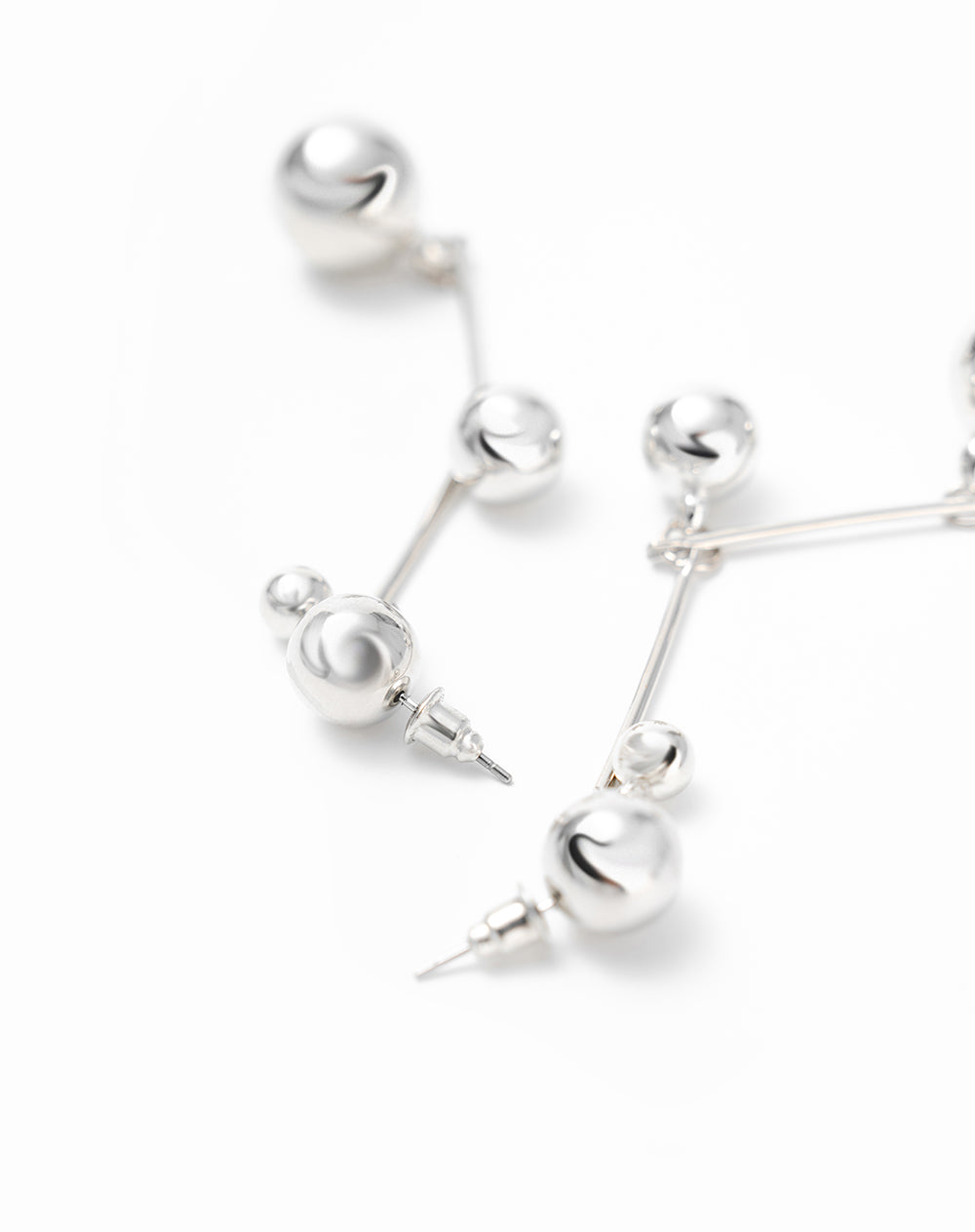 Arete plateado mujer