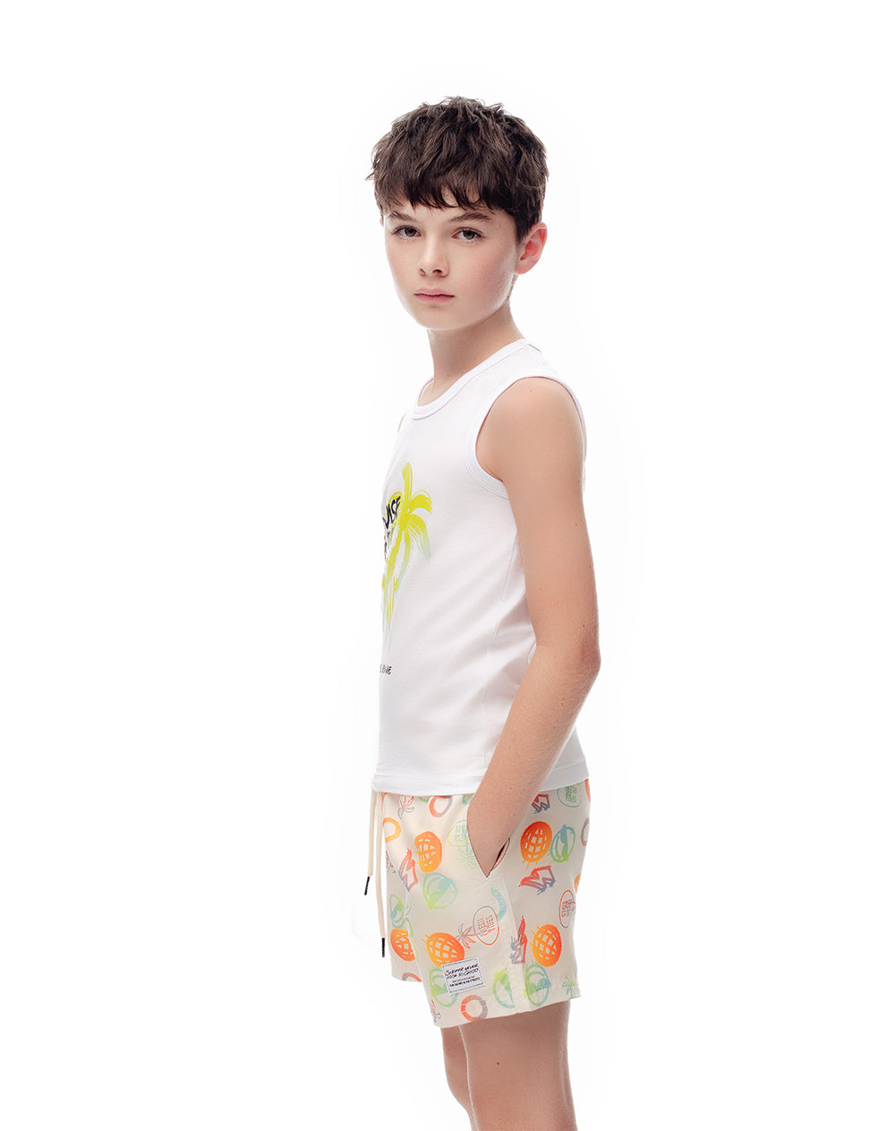 Pantaloneta de baño crema estampada niño
