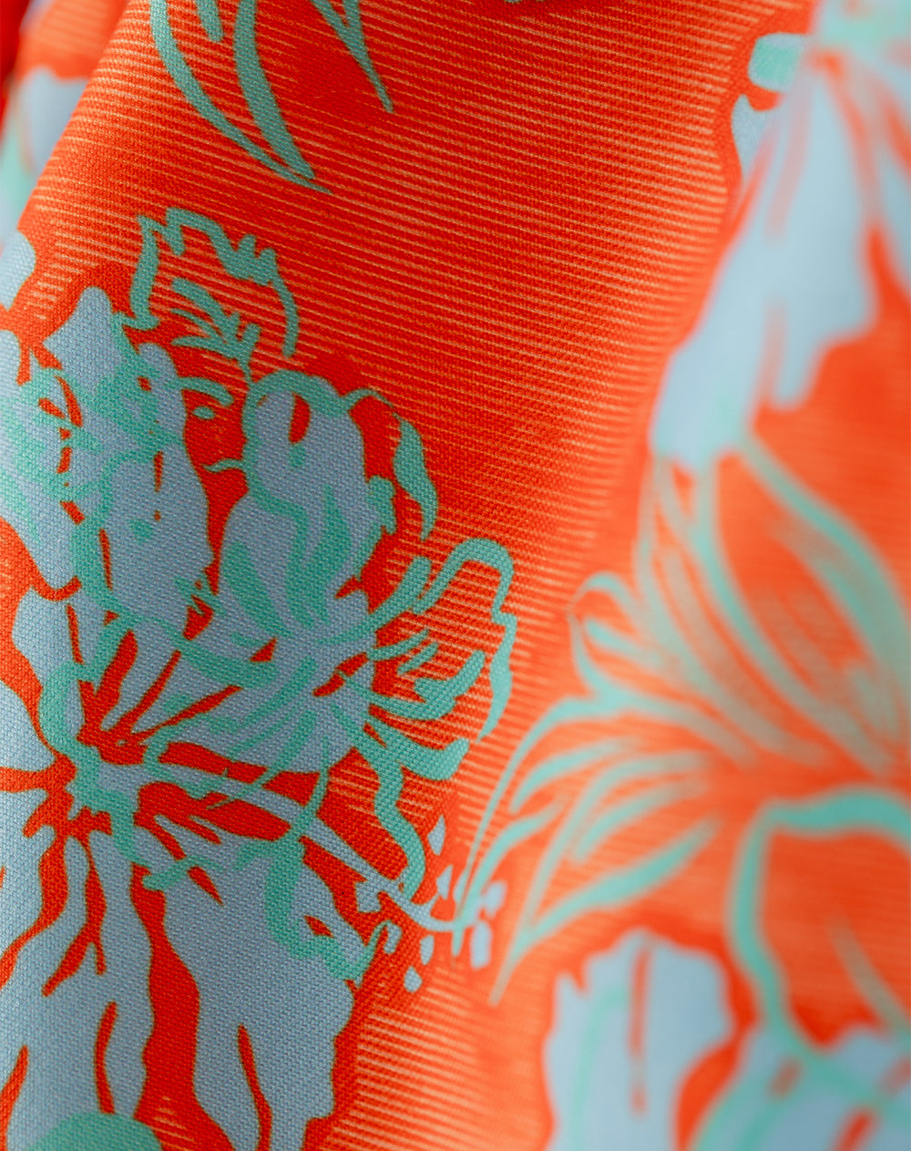 Pantaloneta naranja estampado