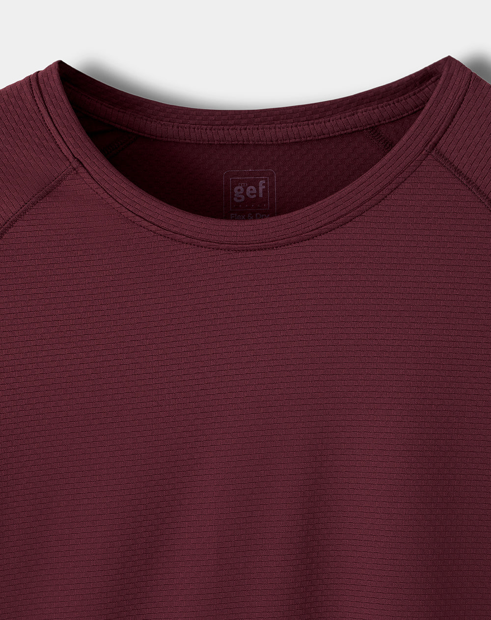 Camiseta deportiva control humedad vinotinto hombre