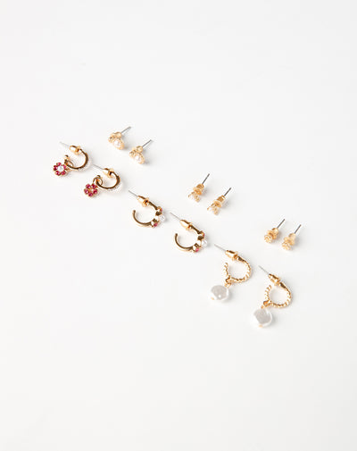 6 pares de aretes dorados