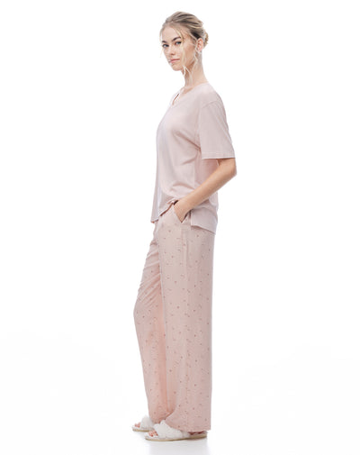 Pantalón relaxed tiro medio rosado estampado mujer