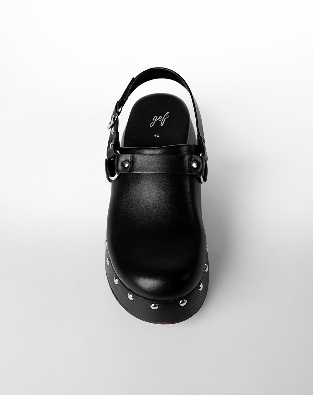 Zuecos tipo mule con plataforma negro mujer