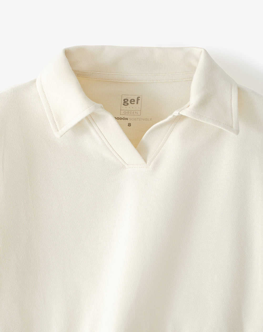 Buzo tipo polo regular crema niña