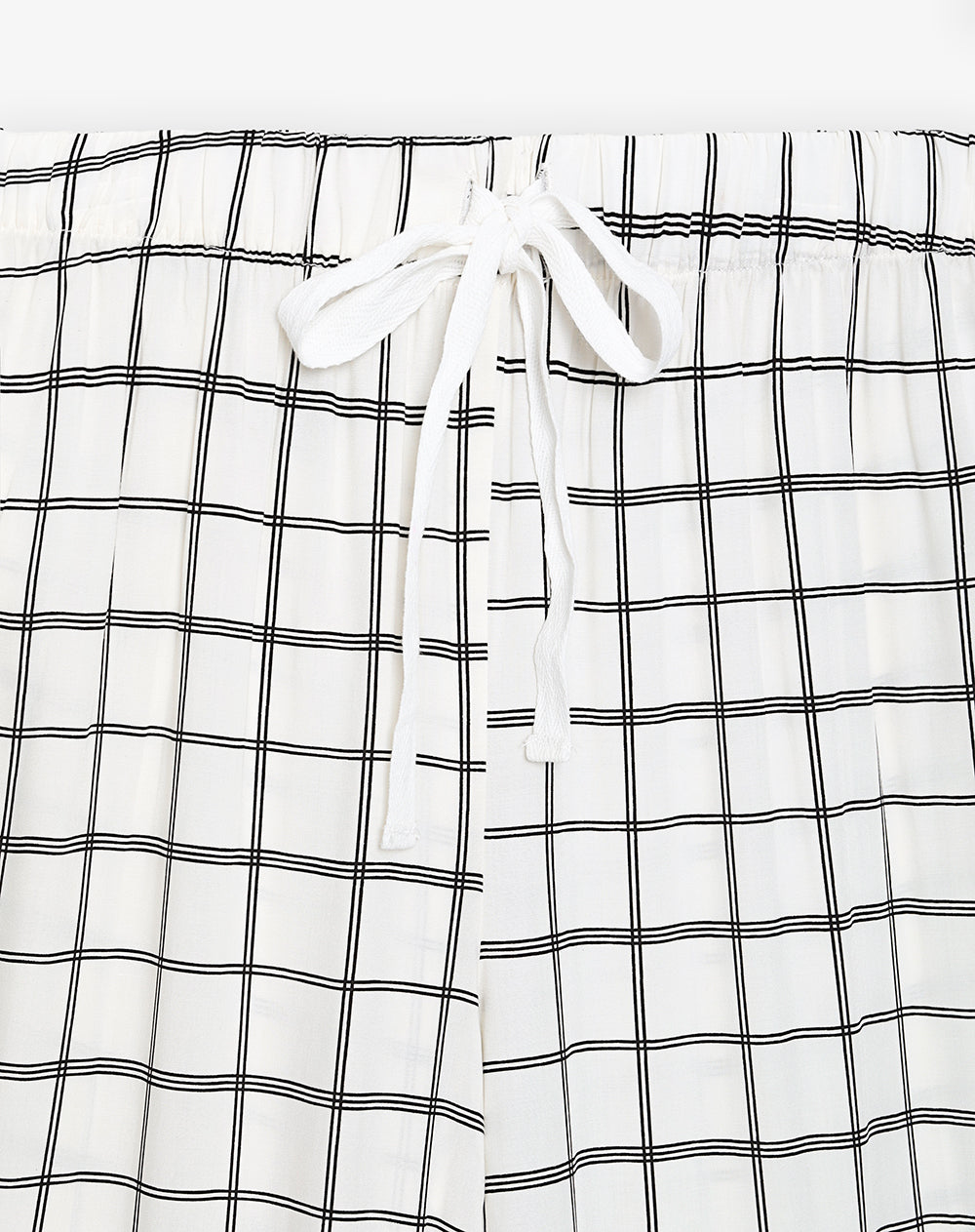 Pantalón regular fit tiro medio crudo estampado