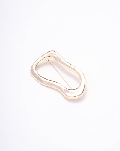 Prendedor asimétrico dorado