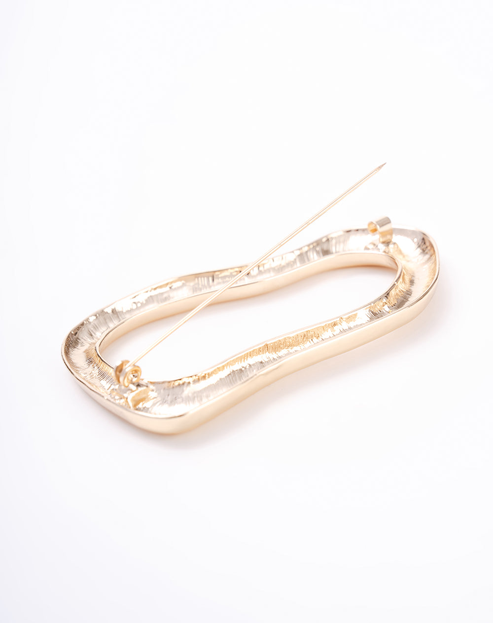 Prendedor asimétrico dorado