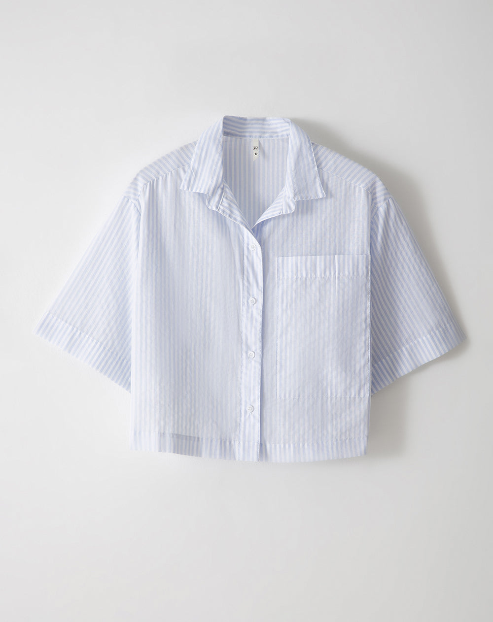 Camisa relaxed fit manga corta rayas azules
