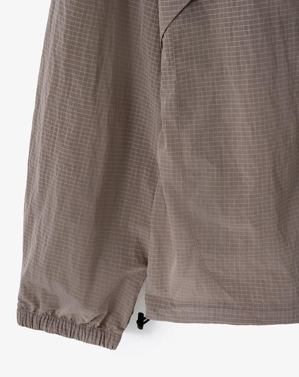 Chaqueta rompevientos café cuadros hombre